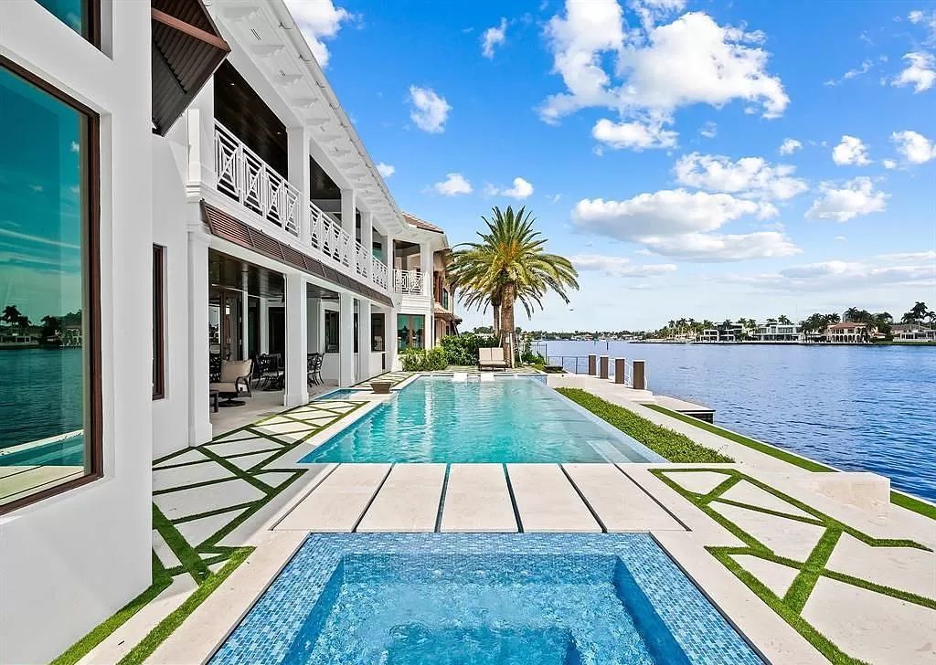 Immerse yourself in the epitome of the "South Florida Lifestyle" at this exquisitely renovated 6-bed, 8-bath West Indies Oasis at 1812 SE 14th St, Fort Lauderdale, FL. This 7,221 sq ft estate boasts a grand Great Room with 20' ceilings and panoramic water views, a media room, and a chef's kitchen with a La’Corneu gas range.