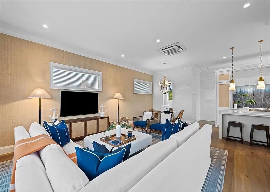 Immerse yourself in the epitome of the "South Florida Lifestyle" at this exquisitely renovated 6-bed, 8-bath West Indies Oasis at 1812 SE 14th St, Fort Lauderdale, FL. This 7,221 sq ft estate boasts a grand Great Room with 20' ceilings and panoramic water views, a media room, and a chef's kitchen with a La’Corneu gas range.