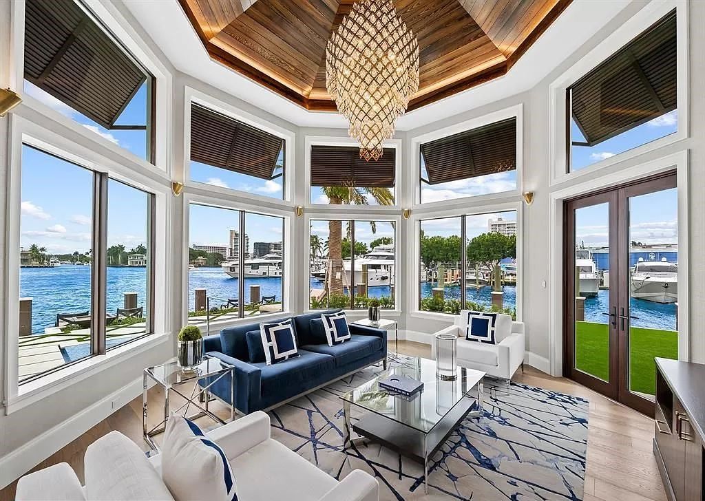 Immerse yourself in the epitome of the "South Florida Lifestyle" at this exquisitely renovated 6-bed, 8-bath West Indies Oasis at 1812 SE 14th St, Fort Lauderdale, FL. This 7,221 sq ft estate boasts a grand Great Room with 20' ceilings and panoramic water views, a media room, and a chef's kitchen with a La’Corneu gas range.