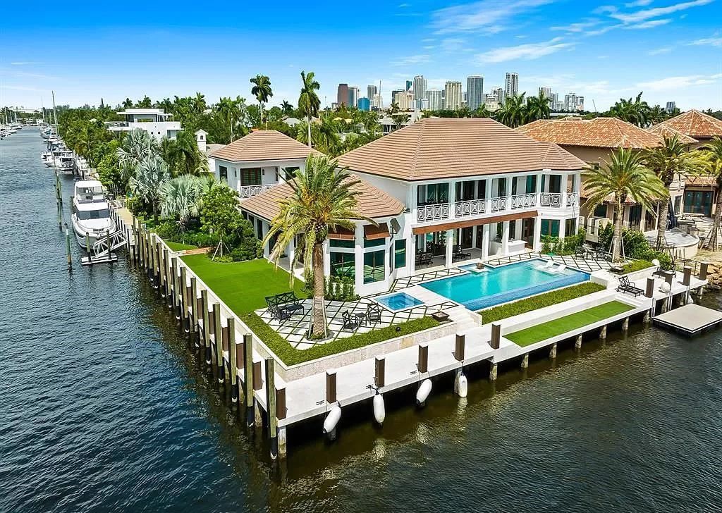 Immerse yourself in the epitome of the "South Florida Lifestyle" at this exquisitely renovated 6-bed, 8-bath West Indies Oasis at 1812 SE 14th St, Fort Lauderdale, FL. This 7,221 sq ft estate boasts a grand Great Room with 20' ceilings and panoramic water views, a media room, and a chef's kitchen with a La’Corneu gas range.