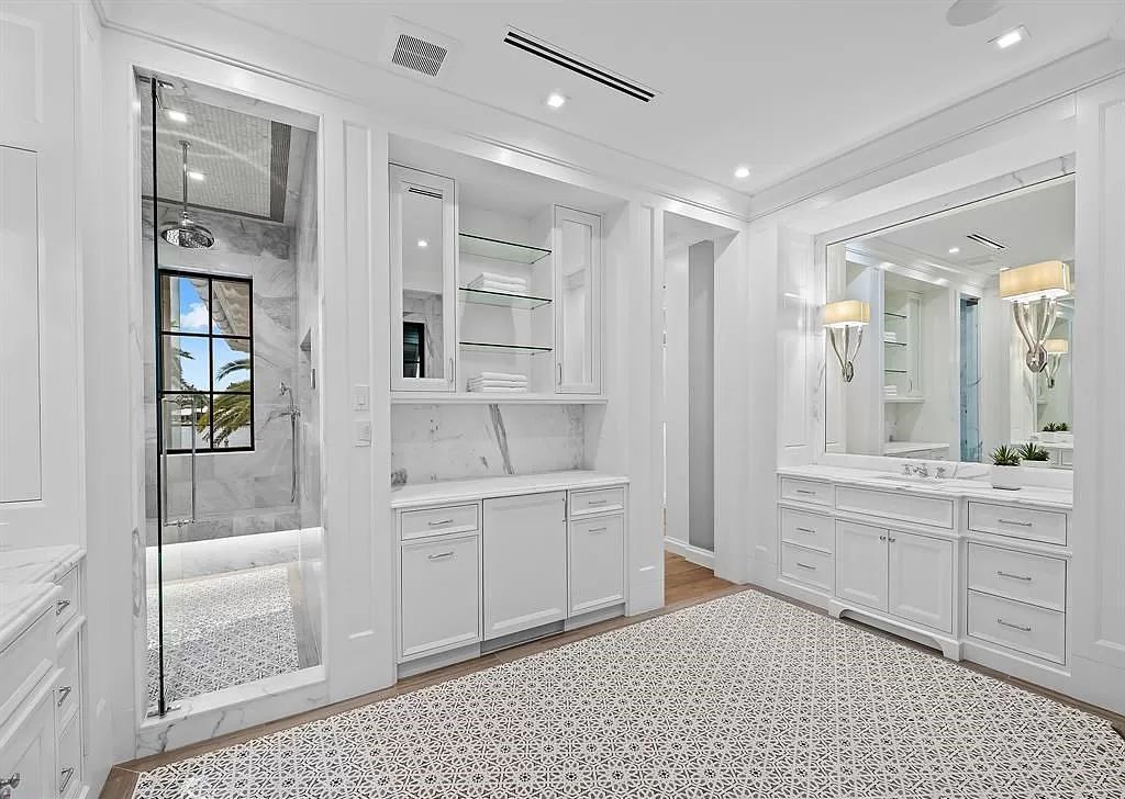 Immerse yourself in the epitome of the "South Florida Lifestyle" at this exquisitely renovated 6-bed, 8-bath West Indies Oasis at 1812 SE 14th St, Fort Lauderdale, FL. This 7,221 sq ft estate boasts a grand Great Room with 20' ceilings and panoramic water views, a media room, and a chef's kitchen with a La’Corneu gas range.