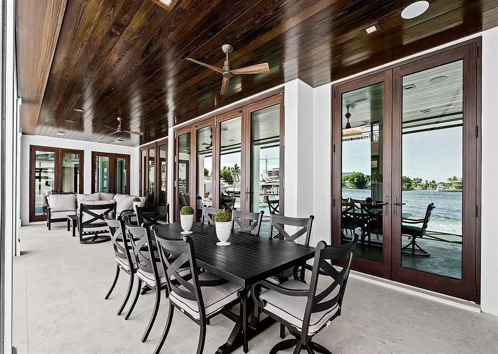 Immerse yourself in the epitome of the "South Florida Lifestyle" at this exquisitely renovated 6-bed, 8-bath West Indies Oasis at 1812 SE 14th St, Fort Lauderdale, FL. This 7,221 sq ft estate boasts a grand Great Room with 20' ceilings and panoramic water views, a media room, and a chef's kitchen with a La’Corneu gas range.