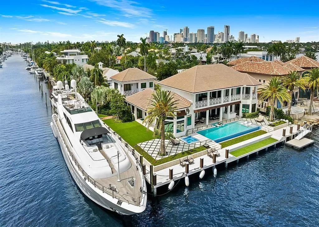 Immerse yourself in the epitome of the "South Florida Lifestyle" at this exquisitely renovated 6-bed, 8-bath West Indies Oasis at 1812 SE 14th St, Fort Lauderdale, FL. This 7,221 sq ft estate boasts a grand Great Room with 20' ceilings and panoramic water views, a media room, and a chef's kitchen with a La’Corneu gas range.