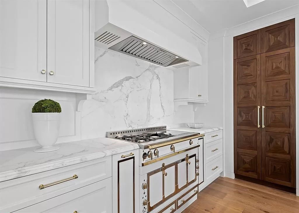 Immerse yourself in the epitome of the "South Florida Lifestyle" at this exquisitely renovated 6-bed, 8-bath West Indies Oasis at 1812 SE 14th St, Fort Lauderdale, FL. This 7,221 sq ft estate boasts a grand Great Room with 20' ceilings and panoramic water views, a media room, and a chef's kitchen with a La’Corneu gas range.