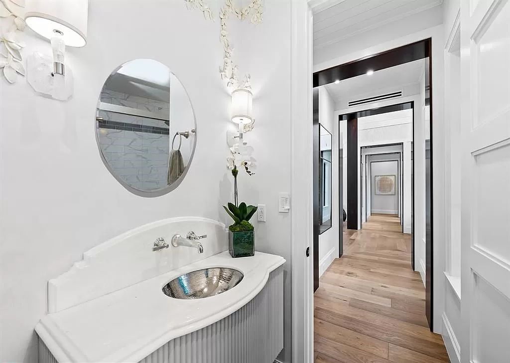 Immerse yourself in the epitome of the "South Florida Lifestyle" at this exquisitely renovated 6-bed, 8-bath West Indies Oasis at 1812 SE 14th St, Fort Lauderdale, FL. This 7,221 sq ft estate boasts a grand Great Room with 20' ceilings and panoramic water views, a media room, and a chef's kitchen with a La’Corneu gas range.