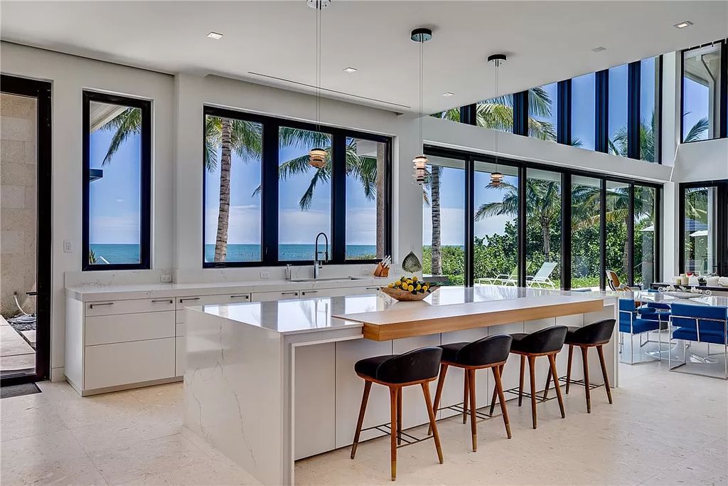 This modern oceanfront estate, located at 6600 N Highway A1a, Hutchinson Island, Florida, spans 1.5 acres and offers unparalleled privacy. With 149 glass windows and doors, it seamlessly blends stone, wood, and glass, creating a masterpiece of luxury and tranquility.