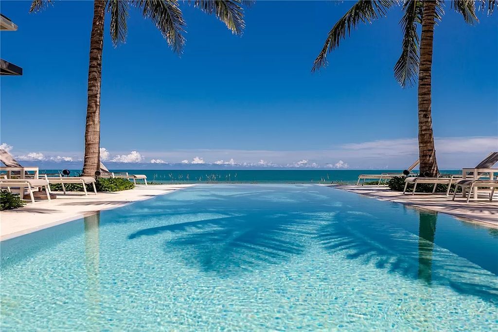 This modern oceanfront estate, located at 6600 N Highway A1a, Hutchinson Island, Florida, spans 1.5 acres and offers unparalleled privacy. With 149 glass windows and doors, it seamlessly blends stone, wood, and glass, creating a masterpiece of luxury and tranquility.