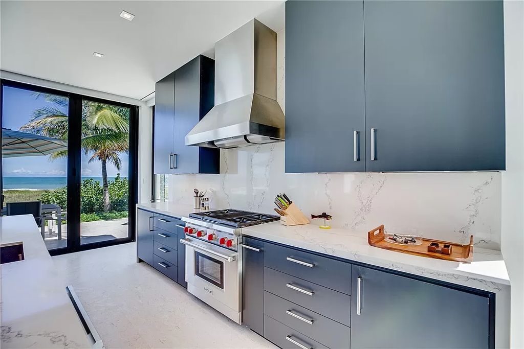 This modern oceanfront estate, located at 6600 N Highway A1a, Hutchinson Island, Florida, spans 1.5 acres and offers unparalleled privacy. With 149 glass windows and doors, it seamlessly blends stone, wood, and glass, creating a masterpiece of luxury and tranquility.