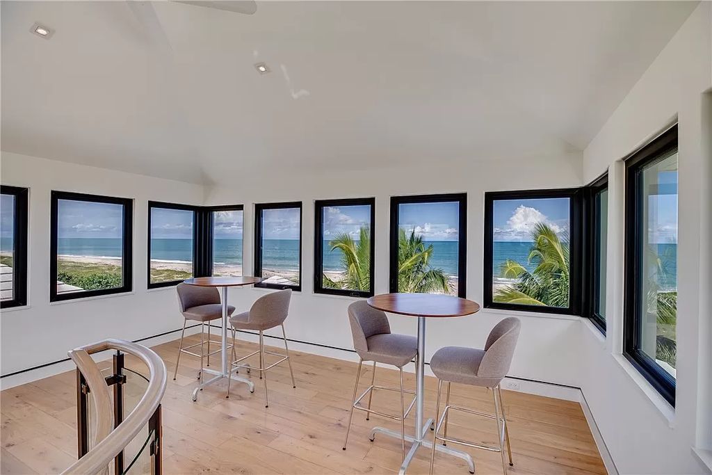 This modern oceanfront estate, located at 6600 N Highway A1a, Hutchinson Island, Florida, spans 1.5 acres and offers unparalleled privacy. With 149 glass windows and doors, it seamlessly blends stone, wood, and glass, creating a masterpiece of luxury and tranquility.
