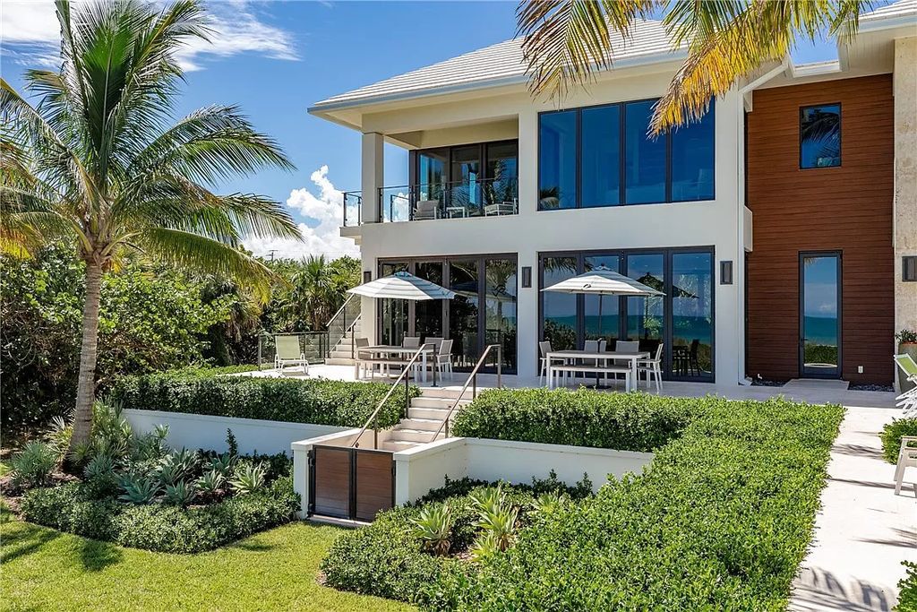 This modern oceanfront estate, located at 6600 N Highway A1a, Hutchinson Island, Florida, spans 1.5 acres and offers unparalleled privacy. With 149 glass windows and doors, it seamlessly blends stone, wood, and glass, creating a masterpiece of luxury and tranquility.