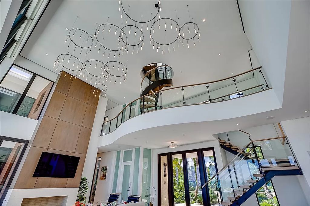 This modern oceanfront estate, located at 6600 N Highway A1a, Hutchinson Island, Florida, spans 1.5 acres and offers unparalleled privacy. With 149 glass windows and doors, it seamlessly blends stone, wood, and glass, creating a masterpiece of luxury and tranquility.