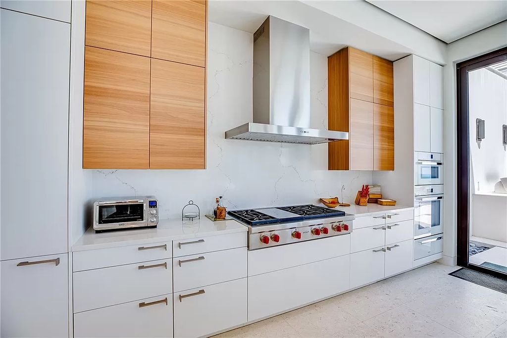 This modern oceanfront estate, located at 6600 N Highway A1a, Hutchinson Island, Florida, spans 1.5 acres and offers unparalleled privacy. With 149 glass windows and doors, it seamlessly blends stone, wood, and glass, creating a masterpiece of luxury and tranquility.