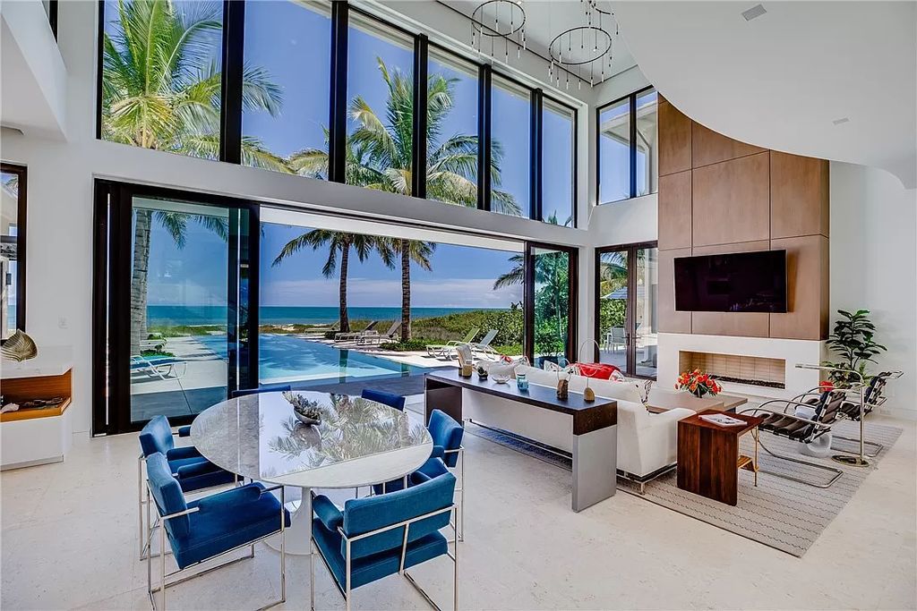 This modern oceanfront estate, located at 6600 N Highway A1a, Hutchinson Island, Florida, spans 1.5 acres and offers unparalleled privacy. With 149 glass windows and doors, it seamlessly blends stone, wood, and glass, creating a masterpiece of luxury and tranquility.