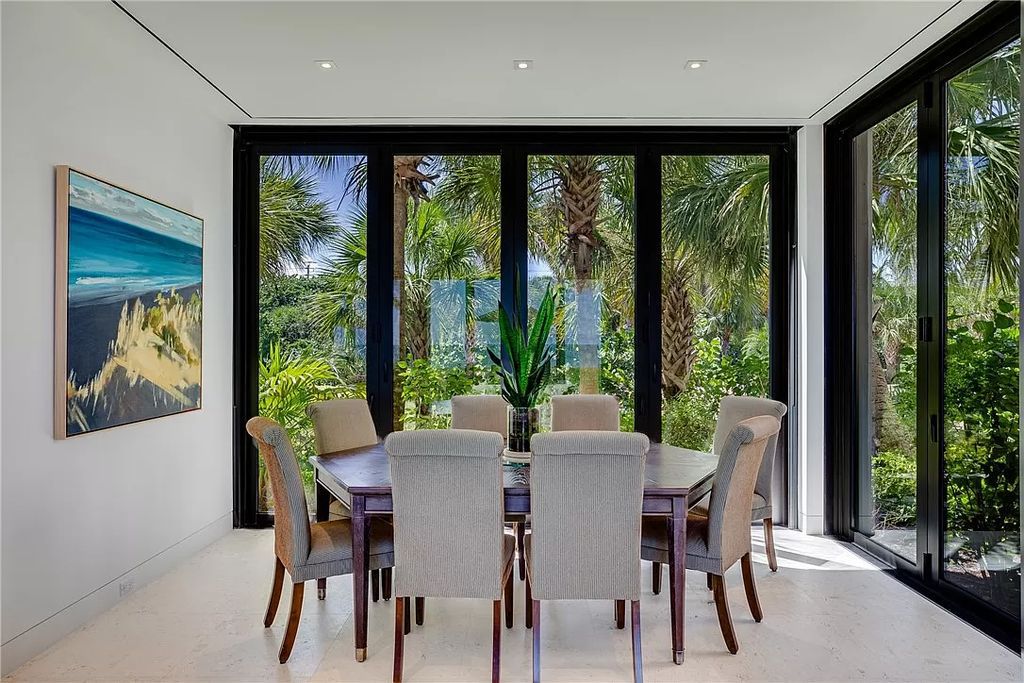 This modern oceanfront estate, located at 6600 N Highway A1a, Hutchinson Island, Florida, spans 1.5 acres and offers unparalleled privacy. With 149 glass windows and doors, it seamlessly blends stone, wood, and glass, creating a masterpiece of luxury and tranquility.