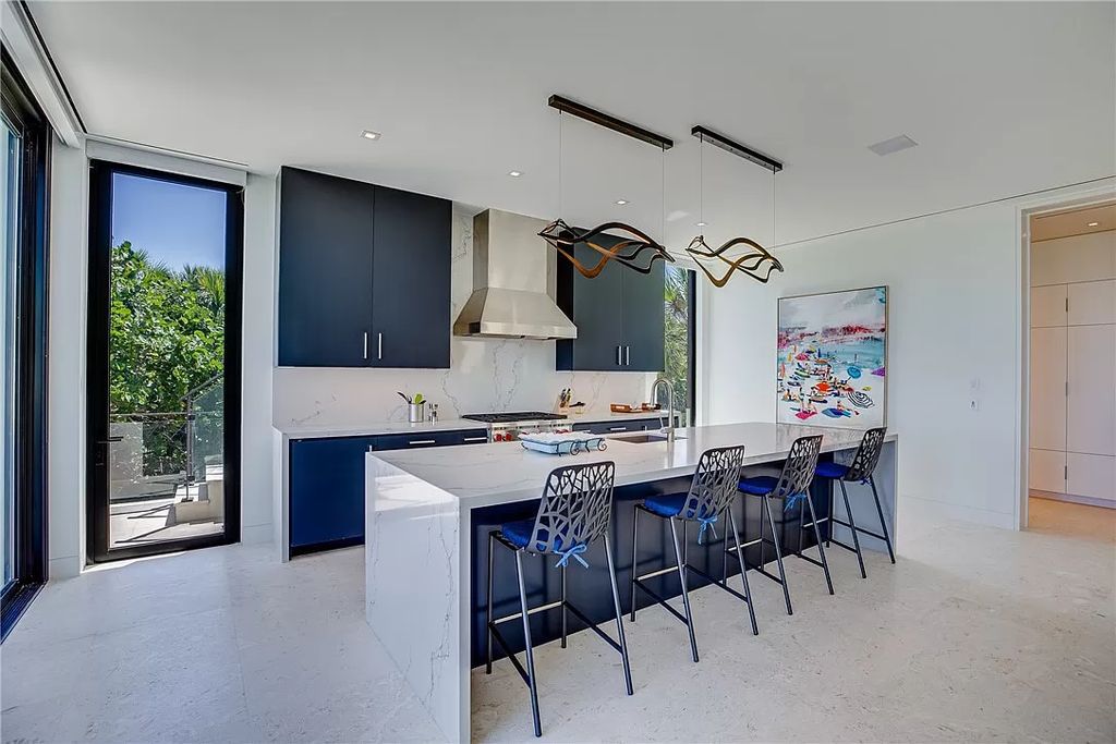 This modern oceanfront estate, located at 6600 N Highway A1a, Hutchinson Island, Florida, spans 1.5 acres and offers unparalleled privacy. With 149 glass windows and doors, it seamlessly blends stone, wood, and glass, creating a masterpiece of luxury and tranquility.