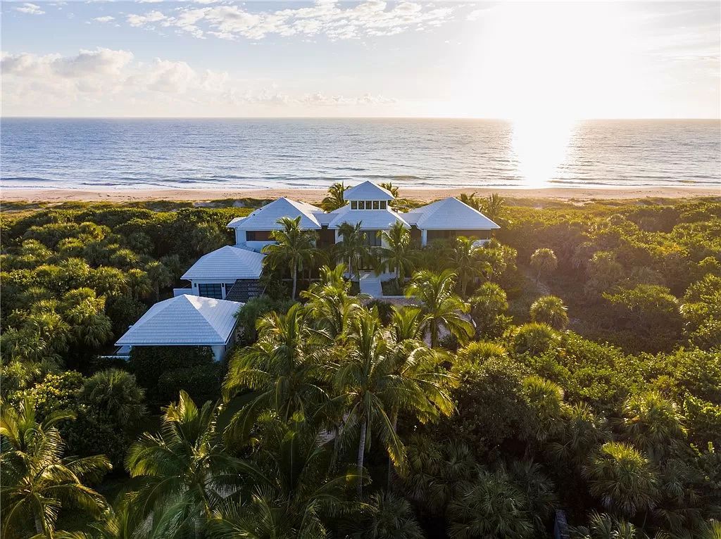 This modern oceanfront estate, located at 6600 N Highway A1a, Hutchinson Island, Florida, spans 1.5 acres and offers unparalleled privacy. With 149 glass windows and doors, it seamlessly blends stone, wood, and glass, creating a masterpiece of luxury and tranquility.