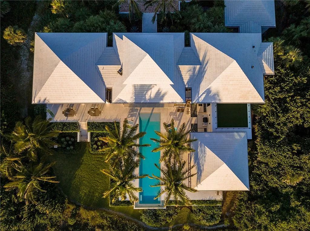 This modern oceanfront estate, located at 6600 N Highway A1a, Hutchinson Island, Florida, spans 1.5 acres and offers unparalleled privacy. With 149 glass windows and doors, it seamlessly blends stone, wood, and glass, creating a masterpiece of luxury and tranquility.