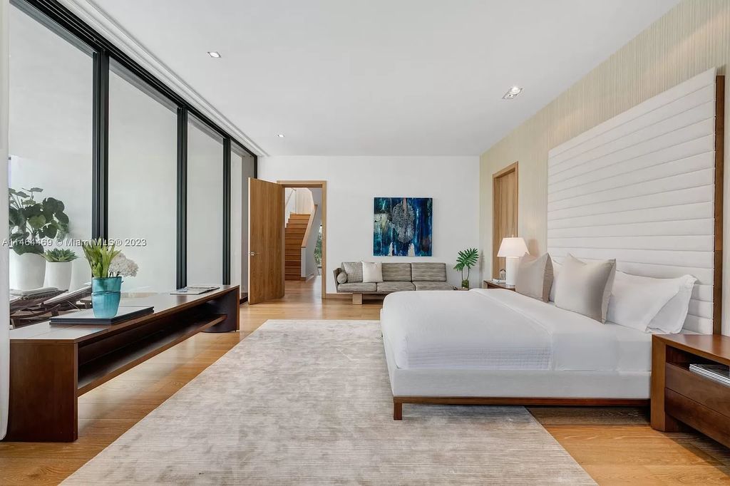 Discover the pinnacle of Miami Beach luxury living at 1142 N Venetian Dr, FL 33139. This 6-bedroom, 6-bath residence spans 6,685 sqft, boasting a seamless blend of contemporary design and comfort. Nestled on the soon-to-be exclusive gated section of the Venetian Islands, this home offers a louvered dining area, media lounge, suede-paneled living salon, and an expansive teak kitchen with Miele & SubZero appliances.