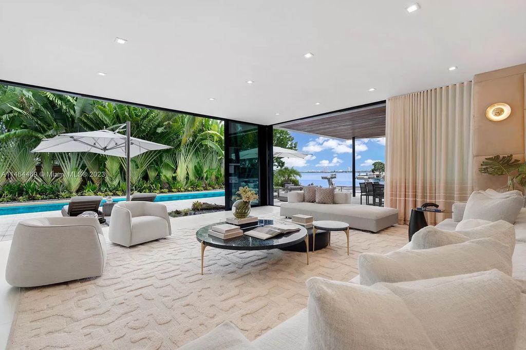 Discover the pinnacle of Miami Beach luxury living at 1142 N Venetian Dr, FL 33139. This 6-bedroom, 6-bath residence spans 6,685 sqft, boasting a seamless blend of contemporary design and comfort. Nestled on the soon-to-be exclusive gated section of the Venetian Islands, this home offers a louvered dining area, media lounge, suede-paneled living salon, and an expansive teak kitchen with Miele & SubZero appliances.