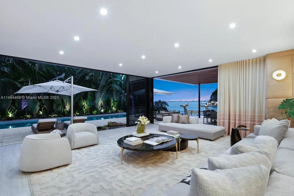 Discover the pinnacle of Miami Beach luxury living at 1142 N Venetian Dr, FL 33139. This 6-bedroom, 6-bath residence spans 6,685 sqft, boasting a seamless blend of contemporary design and comfort. Nestled on the soon-to-be exclusive gated section of the Venetian Islands, this home offers a louvered dining area, media lounge, suede-paneled living salon, and an expansive teak kitchen with Miele & SubZero appliances.
