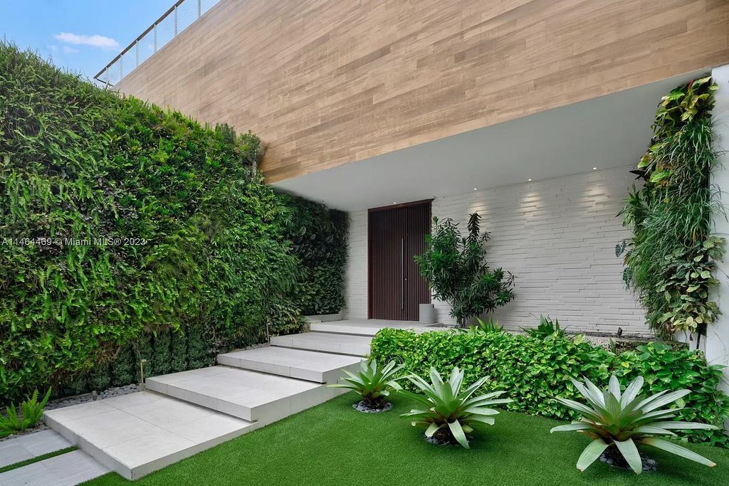 Discover the pinnacle of Miami Beach luxury living at 1142 N Venetian Dr, FL 33139. This 6-bedroom, 6-bath residence spans 6,685 sqft, boasting a seamless blend of contemporary design and comfort. Nestled on the soon-to-be exclusive gated section of the Venetian Islands, this home offers a louvered dining area, media lounge, suede-paneled living salon, and an expansive teak kitchen with Miele & SubZero appliances.