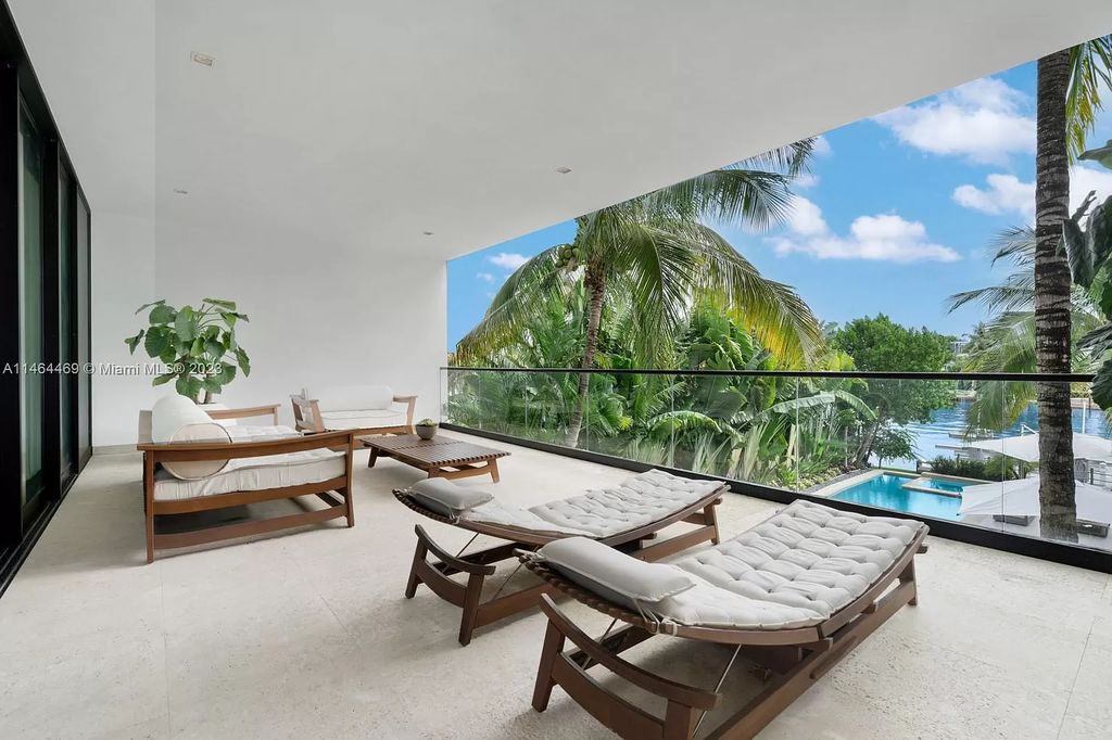 Discover the pinnacle of Miami Beach luxury living at 1142 N Venetian Dr, FL 33139. This 6-bedroom, 6-bath residence spans 6,685 sqft, boasting a seamless blend of contemporary design and comfort. Nestled on the soon-to-be exclusive gated section of the Venetian Islands, this home offers a louvered dining area, media lounge, suede-paneled living salon, and an expansive teak kitchen with Miele & SubZero appliances.