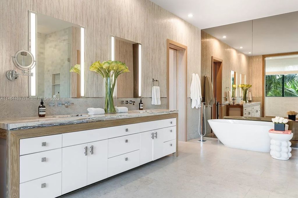 Discover the pinnacle of Miami Beach luxury living at 1142 N Venetian Dr, FL 33139. This 6-bedroom, 6-bath residence spans 6,685 sqft, boasting a seamless blend of contemporary design and comfort. Nestled on the soon-to-be exclusive gated section of the Venetian Islands, this home offers a louvered dining area, media lounge, suede-paneled living salon, and an expansive teak kitchen with Miele & SubZero appliances.