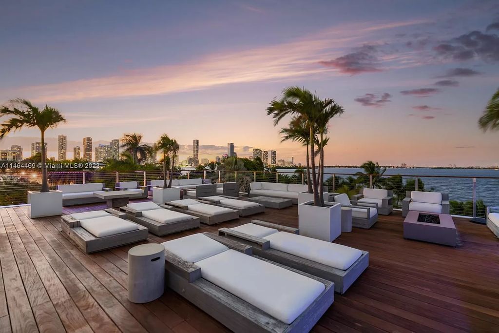 Discover the pinnacle of Miami Beach luxury living at 1142 N Venetian Dr, FL 33139. This 6-bedroom, 6-bath residence spans 6,685 sqft, boasting a seamless blend of contemporary design and comfort. Nestled on the soon-to-be exclusive gated section of the Venetian Islands, this home offers a louvered dining area, media lounge, suede-paneled living salon, and an expansive teak kitchen with Miele & SubZero appliances.