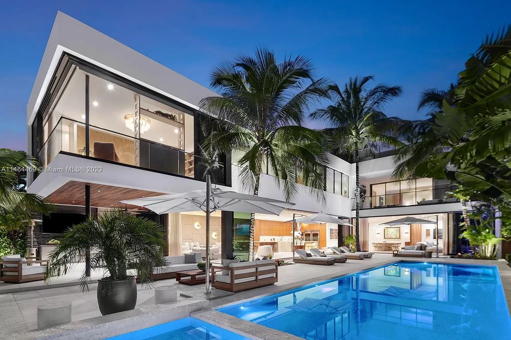 Discover the pinnacle of Miami Beach luxury living at 1142 N Venetian Dr, FL 33139. This 6-bedroom, 6-bath residence spans 6,685 sqft, boasting a seamless blend of contemporary design and comfort. Nestled on the soon-to-be exclusive gated section of the Venetian Islands, this home offers a louvered dining area, media lounge, suede-paneled living salon, and an expansive teak kitchen with Miele & SubZero appliances.