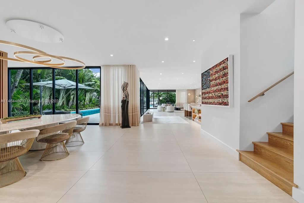 Discover the pinnacle of Miami Beach luxury living at 1142 N Venetian Dr, FL 33139. This 6-bedroom, 6-bath residence spans 6,685 sqft, boasting a seamless blend of contemporary design and comfort. Nestled on the soon-to-be exclusive gated section of the Venetian Islands, this home offers a louvered dining area, media lounge, suede-paneled living salon, and an expansive teak kitchen with Miele & SubZero appliances.