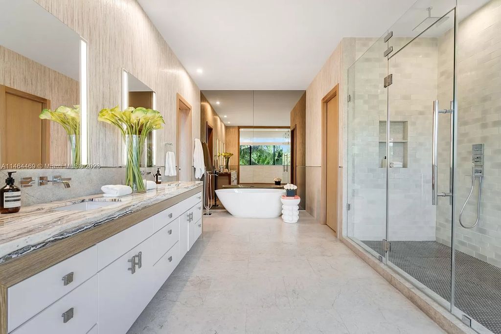 Discover the pinnacle of Miami Beach luxury living at 1142 N Venetian Dr, FL 33139. This 6-bedroom, 6-bath residence spans 6,685 sqft, boasting a seamless blend of contemporary design and comfort. Nestled on the soon-to-be exclusive gated section of the Venetian Islands, this home offers a louvered dining area, media lounge, suede-paneled living salon, and an expansive teak kitchen with Miele & SubZero appliances.