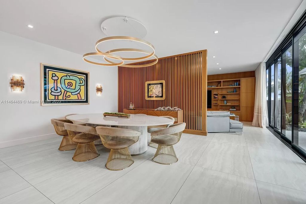 Discover the pinnacle of Miami Beach luxury living at 1142 N Venetian Dr, FL 33139. This 6-bedroom, 6-bath residence spans 6,685 sqft, boasting a seamless blend of contemporary design and comfort. Nestled on the soon-to-be exclusive gated section of the Venetian Islands, this home offers a louvered dining area, media lounge, suede-paneled living salon, and an expansive teak kitchen with Miele & SubZero appliances.