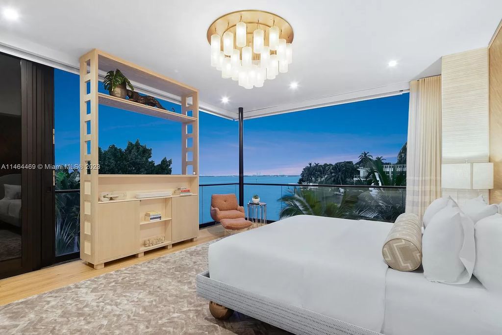 Discover the pinnacle of Miami Beach luxury living at 1142 N Venetian Dr, FL 33139. This 6-bedroom, 6-bath residence spans 6,685 sqft, boasting a seamless blend of contemporary design and comfort. Nestled on the soon-to-be exclusive gated section of the Venetian Islands, this home offers a louvered dining area, media lounge, suede-paneled living salon, and an expansive teak kitchen with Miele & SubZero appliances.