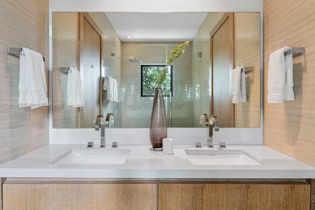 Discover the pinnacle of Miami Beach luxury living at 1142 N Venetian Dr, FL 33139. This 6-bedroom, 6-bath residence spans 6,685 sqft, boasting a seamless blend of contemporary design and comfort. Nestled on the soon-to-be exclusive gated section of the Venetian Islands, this home offers a louvered dining area, media lounge, suede-paneled living salon, and an expansive teak kitchen with Miele & SubZero appliances.