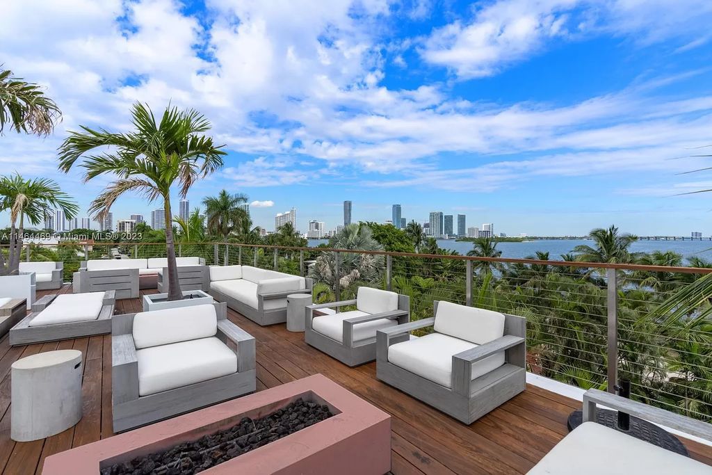 Discover the pinnacle of Miami Beach luxury living at 1142 N Venetian Dr, FL 33139. This 6-bedroom, 6-bath residence spans 6,685 sqft, boasting a seamless blend of contemporary design and comfort. Nestled on the soon-to-be exclusive gated section of the Venetian Islands, this home offers a louvered dining area, media lounge, suede-paneled living salon, and an expansive teak kitchen with Miele & SubZero appliances.