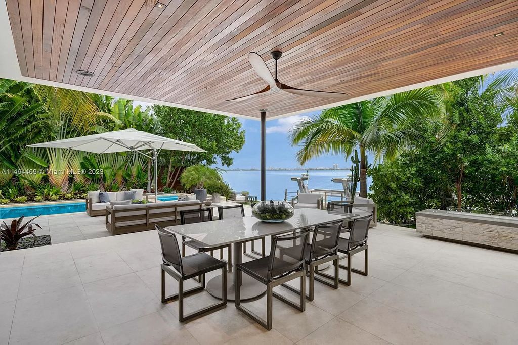 Discover the pinnacle of Miami Beach luxury living at 1142 N Venetian Dr, FL 33139. This 6-bedroom, 6-bath residence spans 6,685 sqft, boasting a seamless blend of contemporary design and comfort. Nestled on the soon-to-be exclusive gated section of the Venetian Islands, this home offers a louvered dining area, media lounge, suede-paneled living salon, and an expansive teak kitchen with Miele & SubZero appliances.