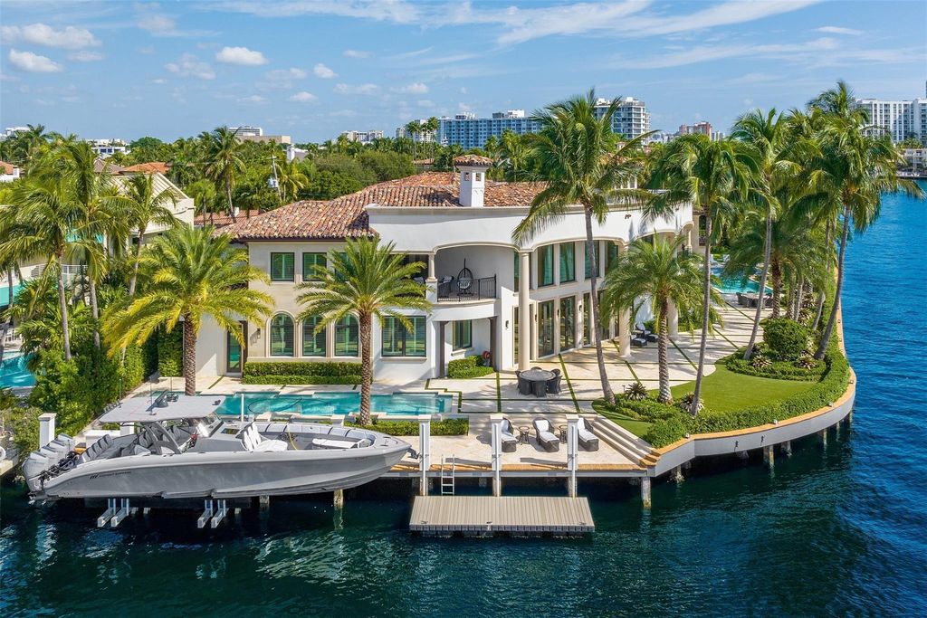 Discover the epitome of luxury waterfront living in this exceptional 6-bedroom, 8-bathroom estate at 2724 Sea Island Dr, Fort Lauderdale. Located in the prestigious Seven Isles neighborhood, this half-acre double lot showcases two pools, covered outdoor spaces, and 325 feet of southeast-exposure waterfront.