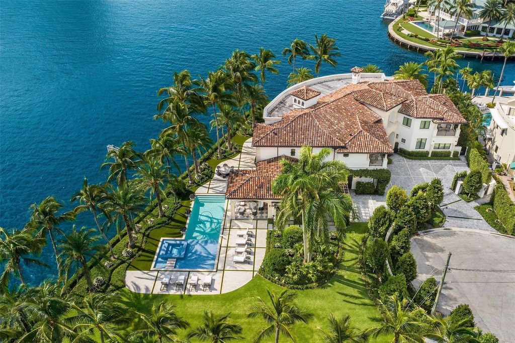 Discover the epitome of luxury waterfront living in this exceptional 6-bedroom, 8-bathroom estate at 2724 Sea Island Dr, Fort Lauderdale. Located in the prestigious Seven Isles neighborhood, this half-acre double lot showcases two pools, covered outdoor spaces, and 325 feet of southeast-exposure waterfront.