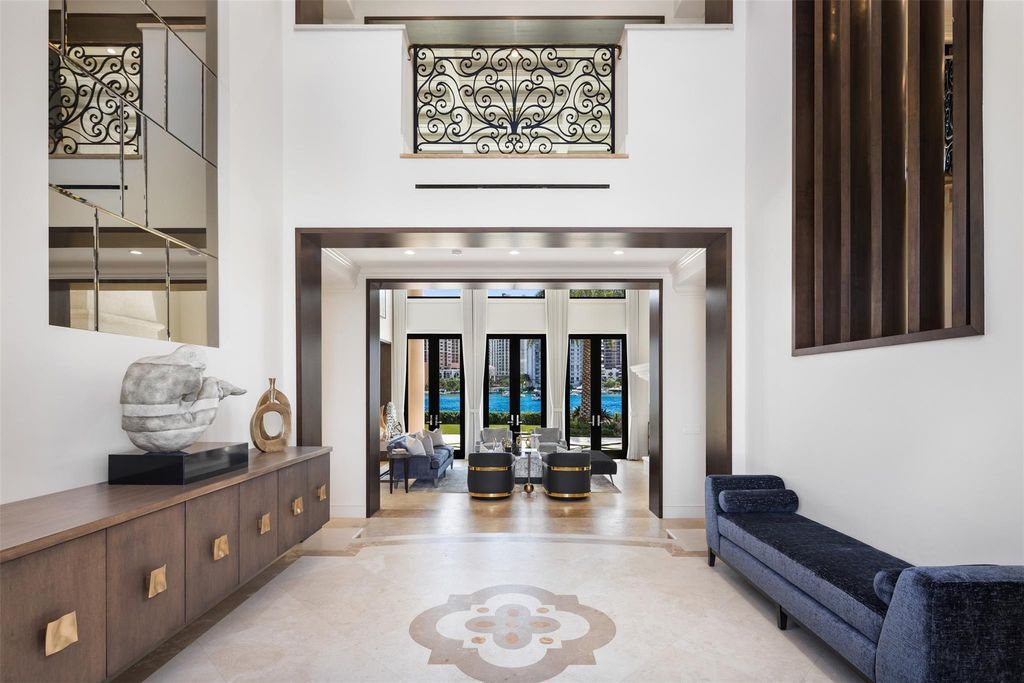 Discover the epitome of luxury waterfront living in this exceptional 6-bedroom, 8-bathroom estate at 2724 Sea Island Dr, Fort Lauderdale. Located in the prestigious Seven Isles neighborhood, this half-acre double lot showcases two pools, covered outdoor spaces, and 325 feet of southeast-exposure waterfront.