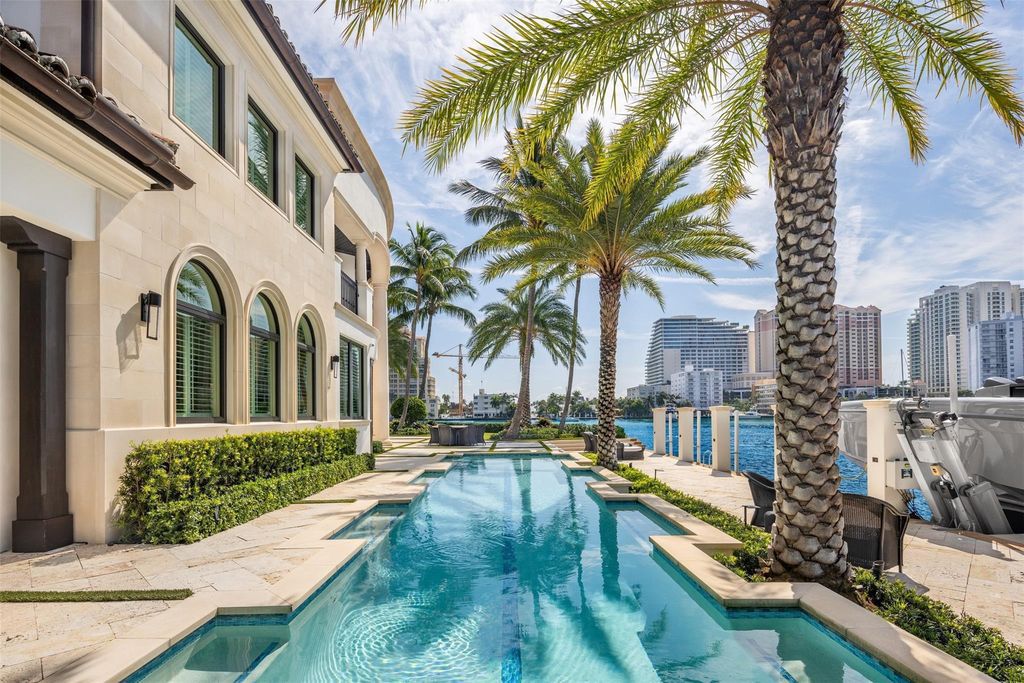 Discover the epitome of luxury waterfront living in this exceptional 6-bedroom, 8-bathroom estate at 2724 Sea Island Dr, Fort Lauderdale. Located in the prestigious Seven Isles neighborhood, this half-acre double lot showcases two pools, covered outdoor spaces, and 325 feet of southeast-exposure waterfront.