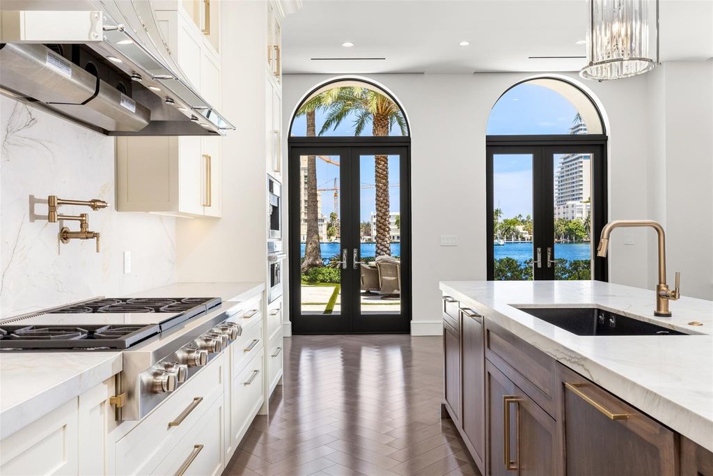 Discover the epitome of luxury waterfront living in this exceptional 6-bedroom, 8-bathroom estate at 2724 Sea Island Dr, Fort Lauderdale. Located in the prestigious Seven Isles neighborhood, this half-acre double lot showcases two pools, covered outdoor spaces, and 325 feet of southeast-exposure waterfront.