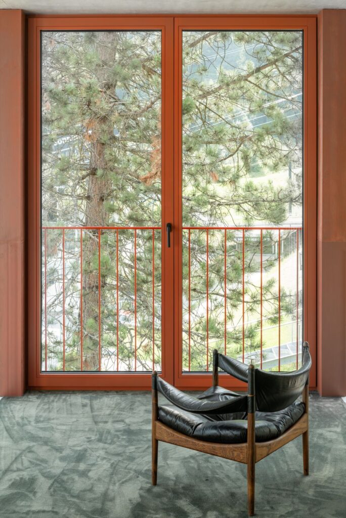 House Schmitten A Vibrantly Red Alpine Chalet by Steiner Architecture 11
