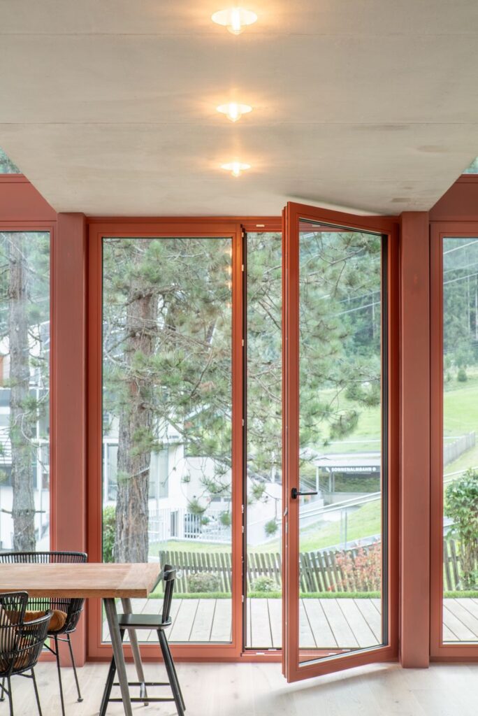 House Schmitten A Vibrantly Red Alpine Chalet by Steiner Architecture 16