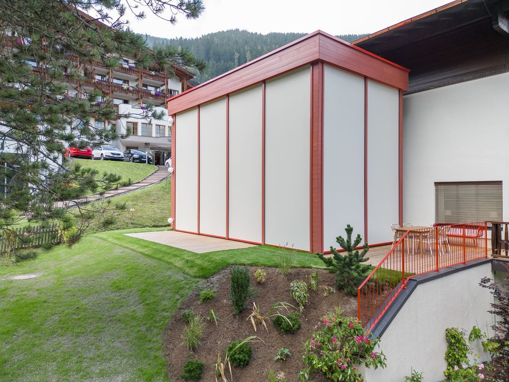 House Schmitten, A Vibrantly Red Alpine Chalet by Steiner Architecture