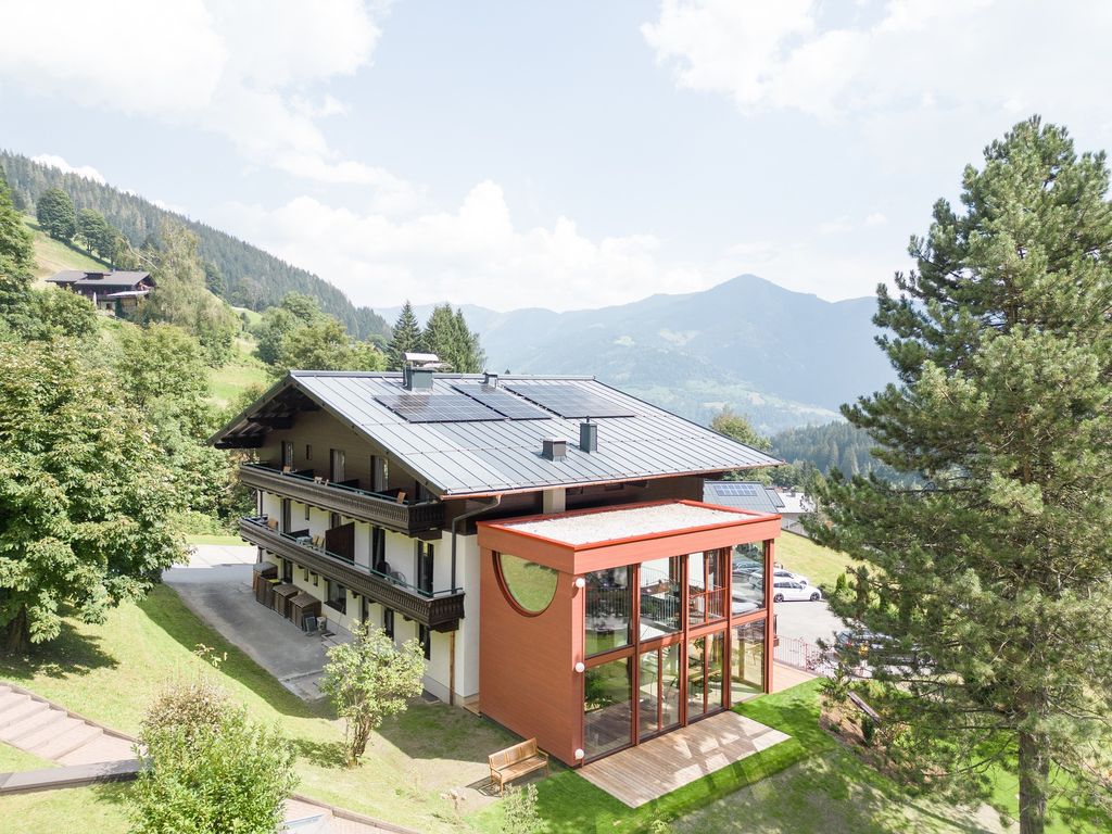 House Schmitten, A Vibrantly Red Alpine Chalet by Steiner Architecture