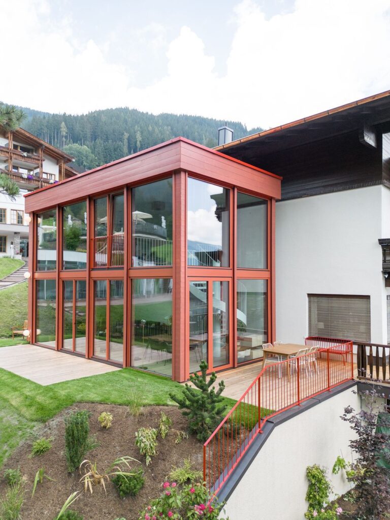 House Schmitten A Vibrantly Red Alpine Chalet by Steiner Architecture 4
