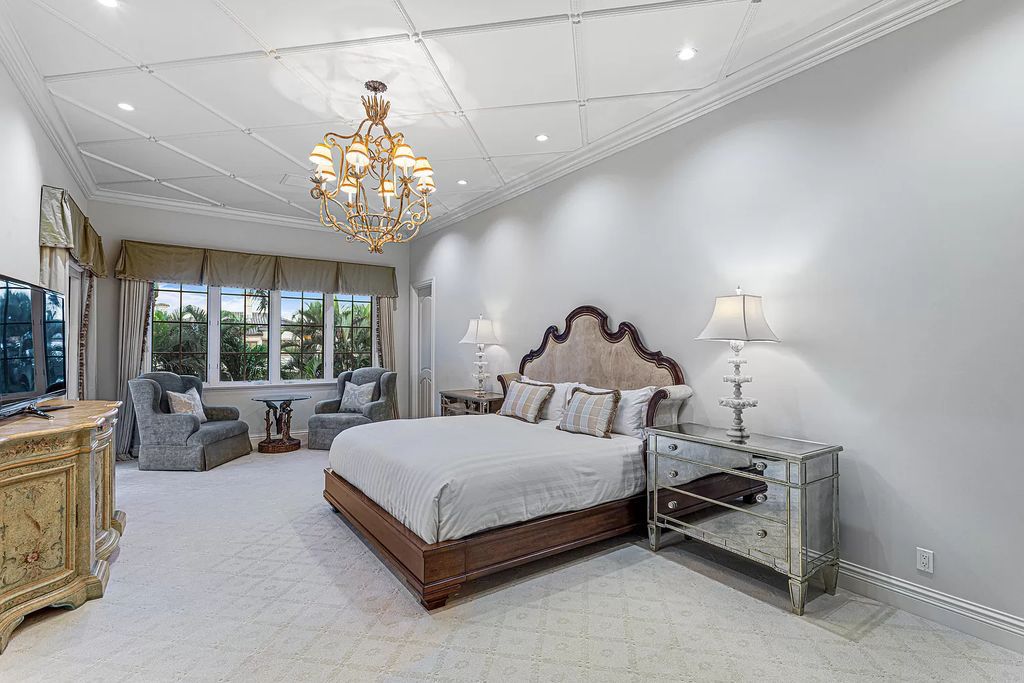 Nestled on a prime 1.06-acre waterfront estate at 5001 Egret Point Circle, Boca Raton, this Italianate marvel in The Sanctuary presents 8 bedrooms, 14 baths, and 14,848 square feet of opulent living space, meticulously crafted in 2005.