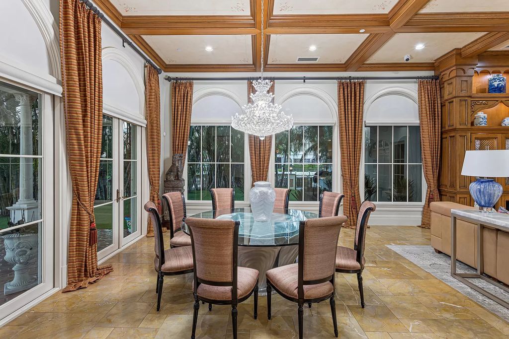 Nestled on a prime 1.06-acre waterfront estate at 5001 Egret Point Circle, Boca Raton, this Italianate marvel in The Sanctuary presents 8 bedrooms, 14 baths, and 14,848 square feet of opulent living space, meticulously crafted in 2005.