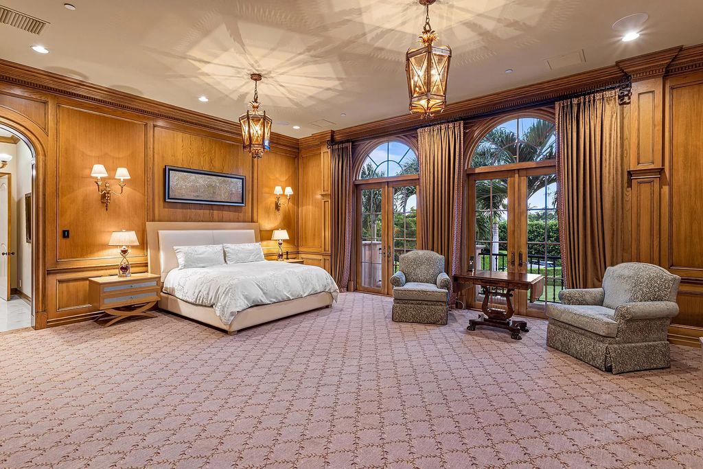 Nestled on a prime 1.06-acre waterfront estate at 5001 Egret Point Circle, Boca Raton, this Italianate marvel in The Sanctuary presents 8 bedrooms, 14 baths, and 14,848 square feet of opulent living space, meticulously crafted in 2005.