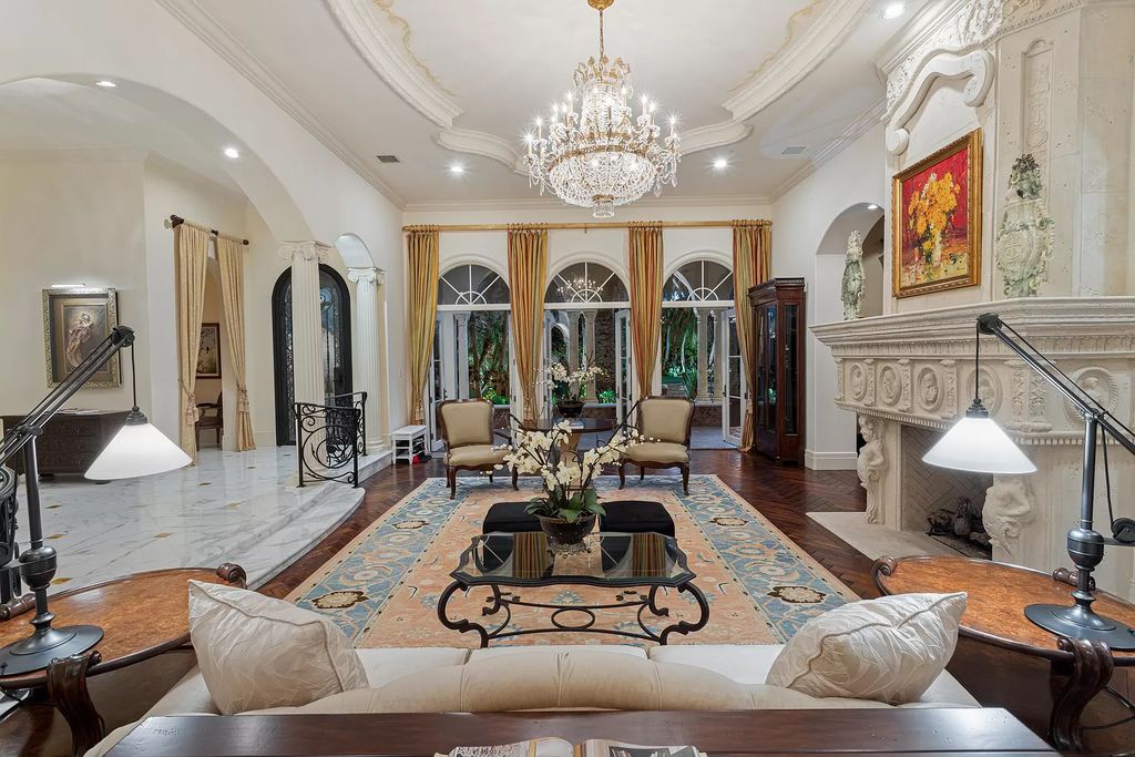 Nestled on a prime 1.06-acre waterfront estate at 5001 Egret Point Circle, Boca Raton, this Italianate marvel in The Sanctuary presents 8 bedrooms, 14 baths, and 14,848 square feet of opulent living space, meticulously crafted in 2005.